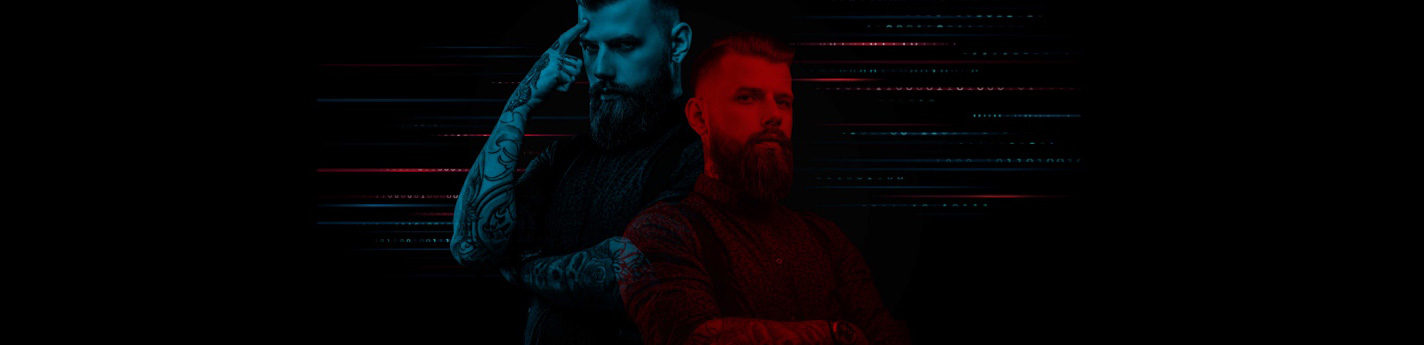 Man with a large beard in blue with arm tattoos and in red wearing a button down shirt
