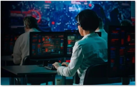 People working in a busy SOC