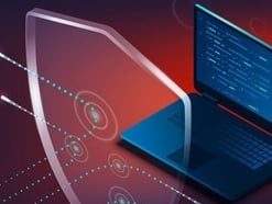Laptop with a clear shield in front of it deflecting threats