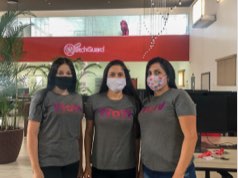 3 dark haired women in WOW - Women of WatchGuard t-shirts